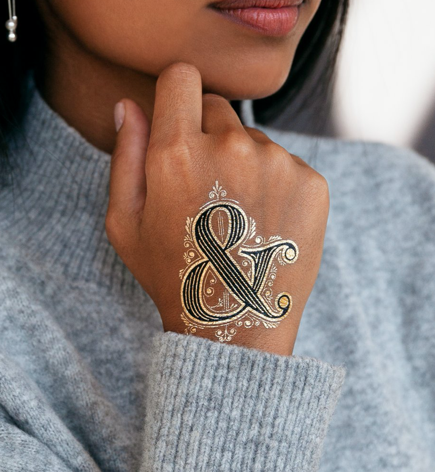ampersand finger tattoo